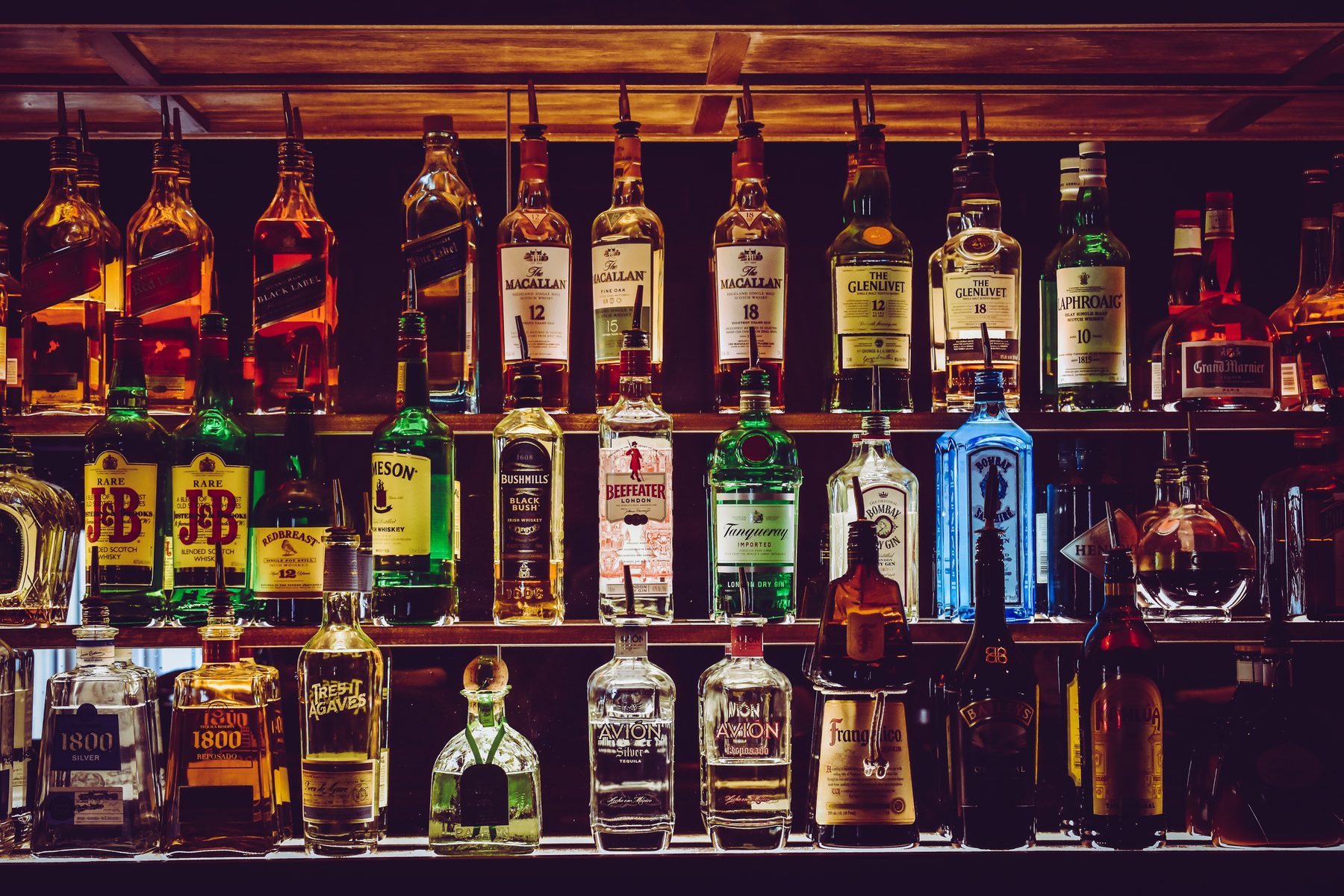 Bottles lined up on the back bar of a downtown Healdsburg tasting room